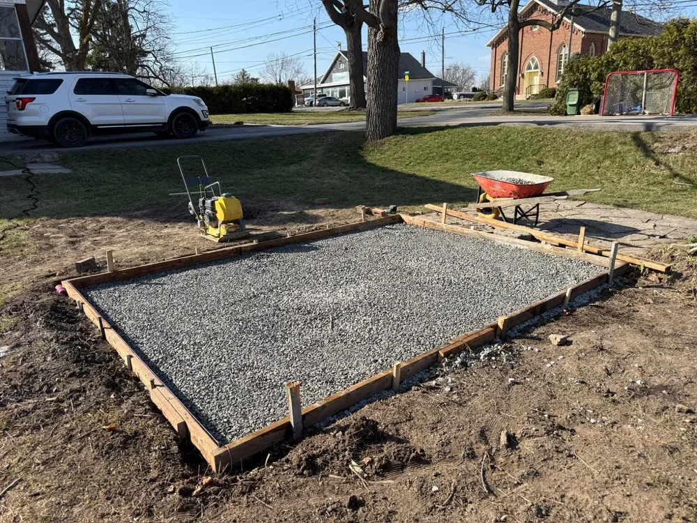 Compacted gravel base prepped for a concrete pour in Stoney Creek, Ontario