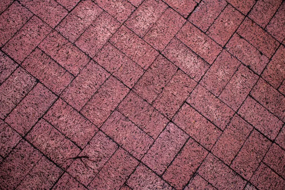 Interlock patio installation with herringbone paver pattern in Ancaster, Ontario